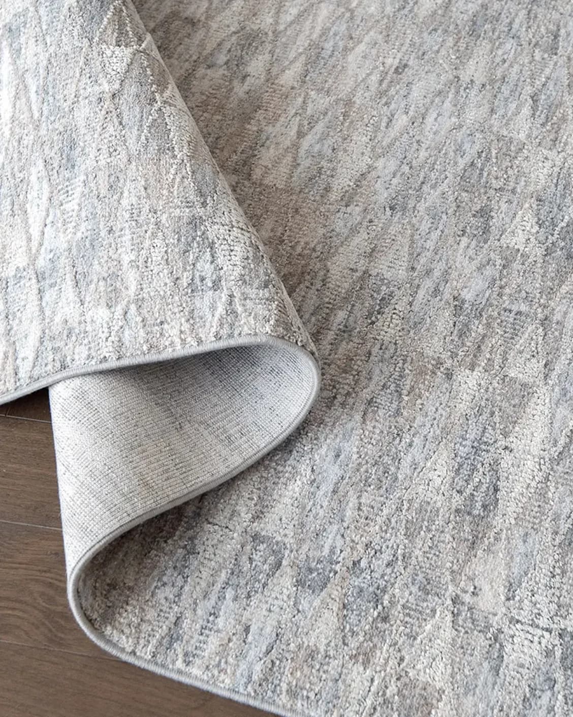Savanna Sky carpet in blue, beige and grey, shown in a product close-up as image 10