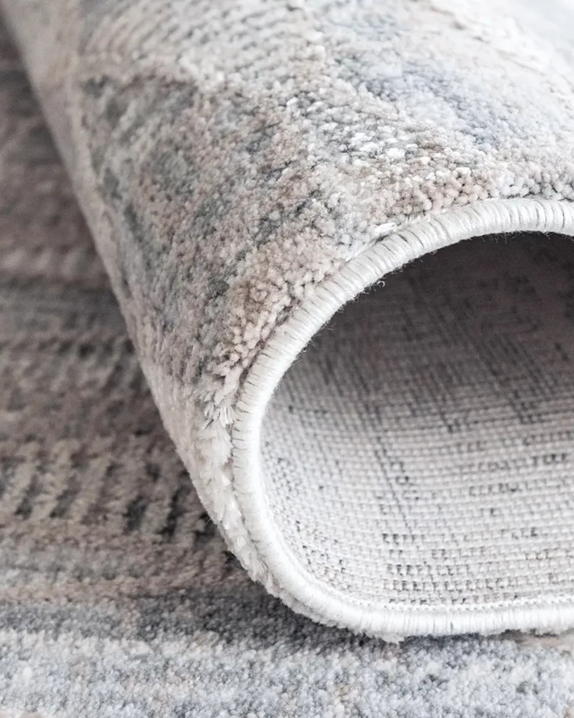 Savanna Sky carpet in blue, beige and grey, shown in a product close-up as image 11