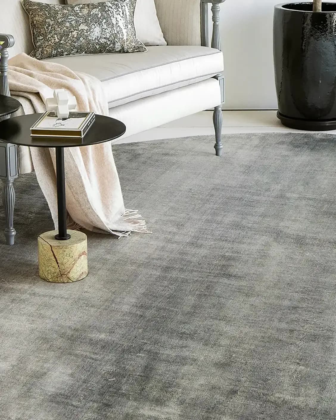 Scarlette Ashton Round carpet in grey, shown in a lifestyle close-up as image 2