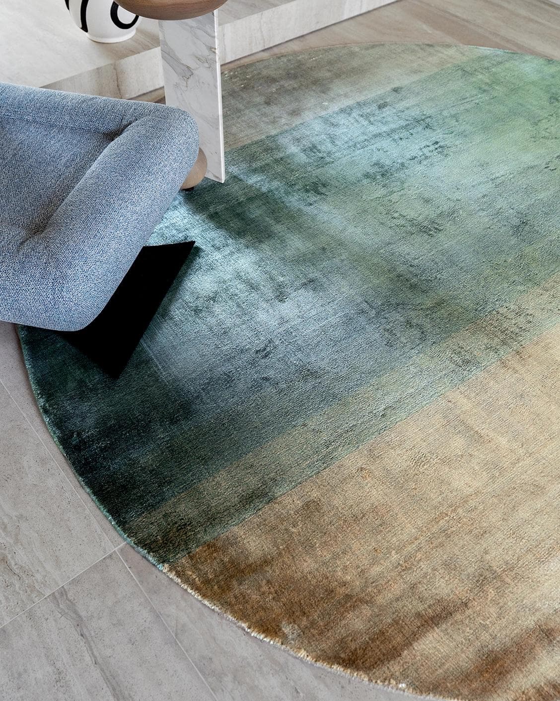 Scarlette Sage Round carpet in beige and green, shown in a lifestyle close-up top view as image 4