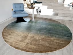 Scarlette Sage Round carpet in beige and green, shown in a lifestyle front view