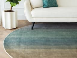 Scarlette Sage Round carpet in beige and green, shown in a lifestyle front view