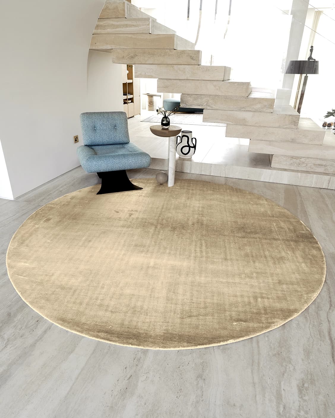 Scarlette Sandy Round carpet in sandy, beige and gold, shown in a lifestyle front view