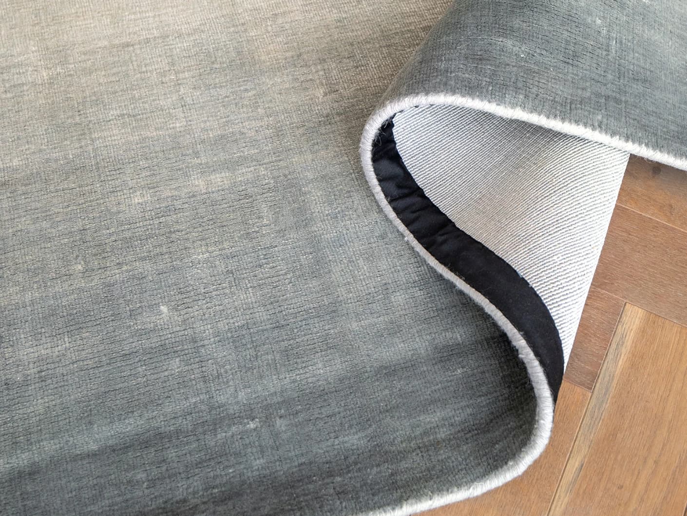 Scarlette Sky Round carpets in sky and blue, shown in a product close-up view