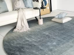 Scarlette Sky Round carpet in sky and blue, shown in a lifestyle front view