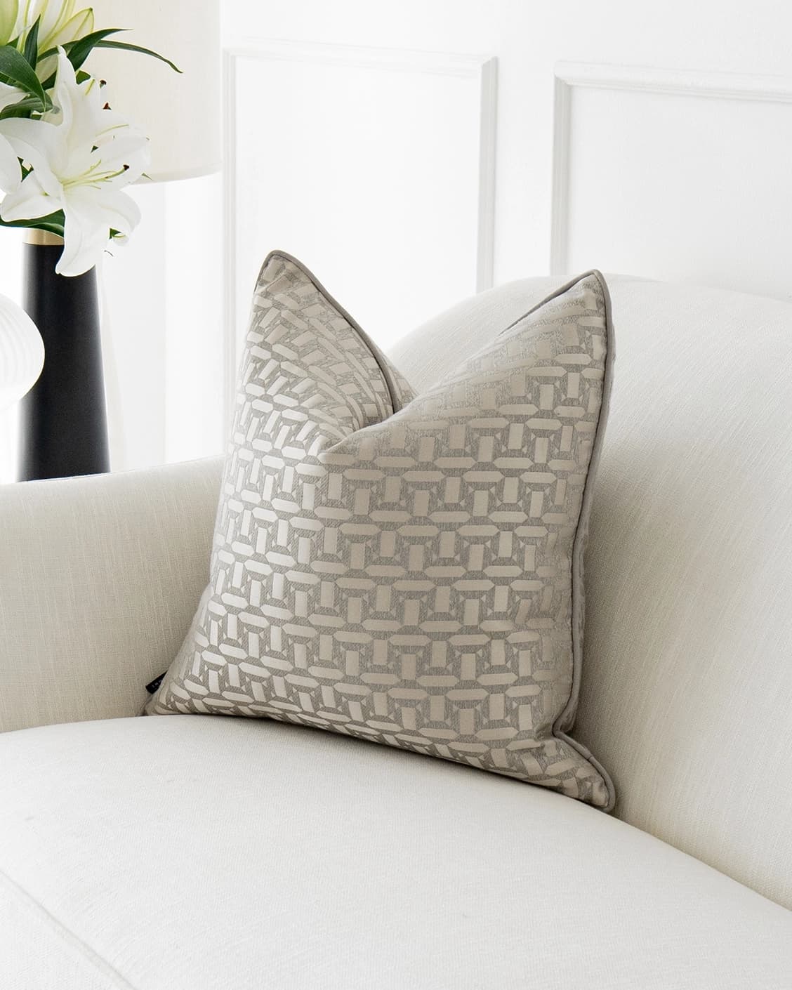 Selena Laurent cushion in white and silver, shown in a lifestyle front view as image 2