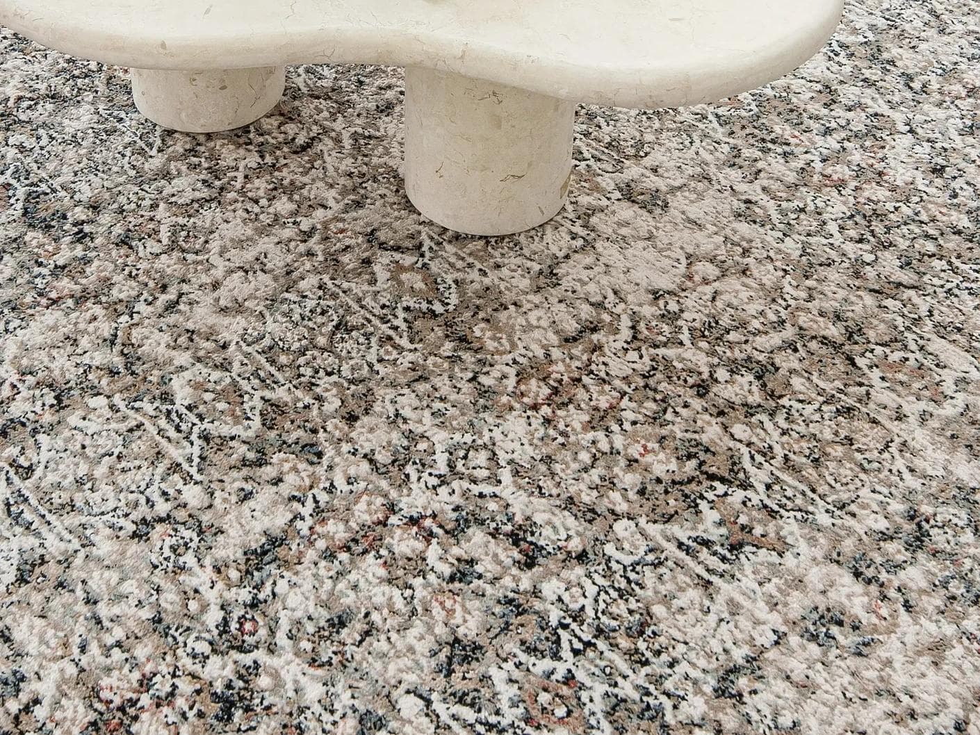 Sheldon Ebony carpet in black and beige, shown in a lifestyle close-up as image 4