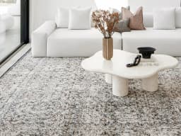 Sheldon Ebony carpet in ebony, black and beige, shown in a lifestyle front view