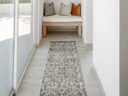 Sheldon Ebony Runners carpet in black and beige, shown in a lifestyle front view