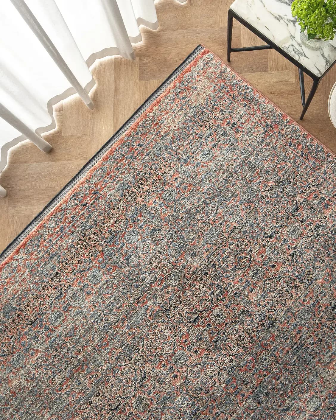 Sheldon Rosso carpet in red and rust, shown in a lifestyle top view as image 2