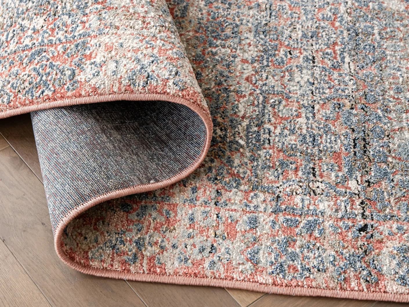 Sheldon Rosso carpets in red and rust, shown in a product close-up view