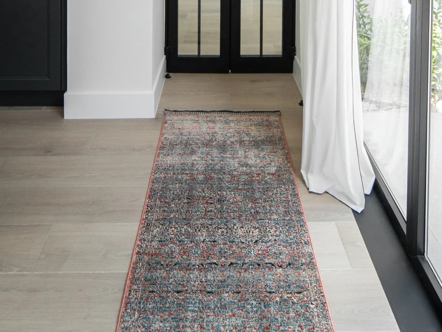 Sheldon Rosso Runners carpet in red and rust, shown in a lifestyle front view