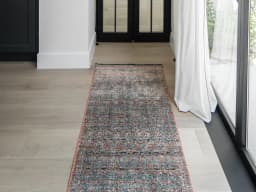 Sheldon Rosso Runners carpet in red and rust, shown in a lifestyle front view
