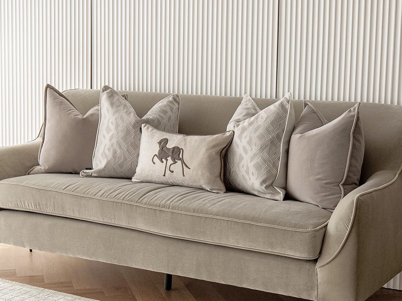 Sherwin Bundle bundle cushions in beige, white and brown, shown in a lifestyle front view