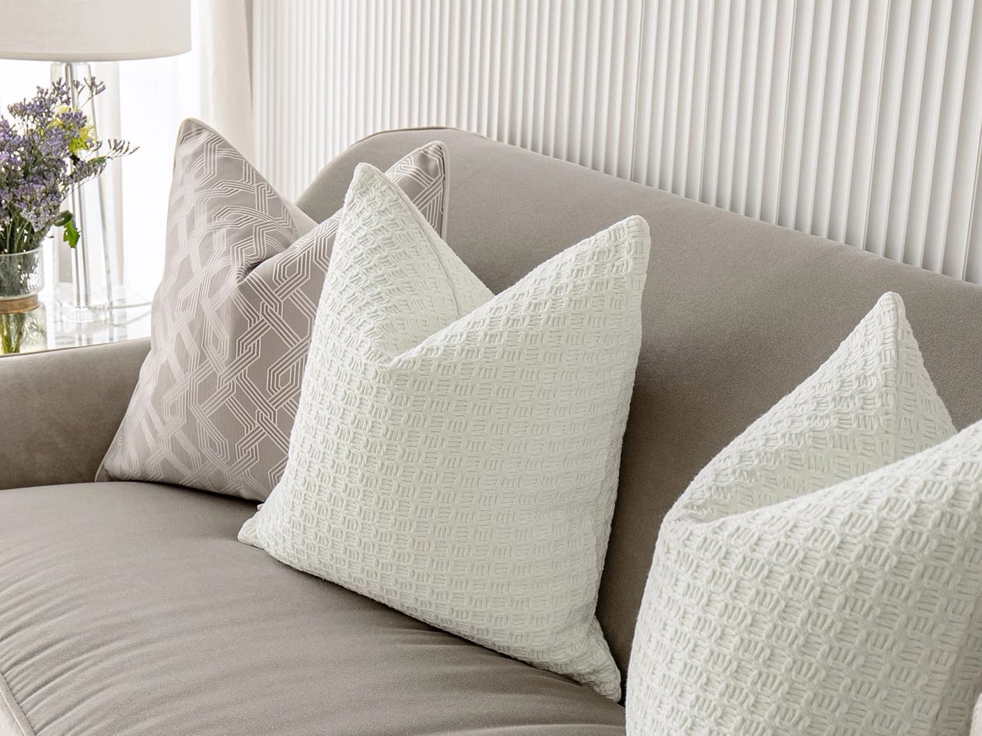 Shilo Bundle bundle cushions in white and beige, shown in a lifestyle front view