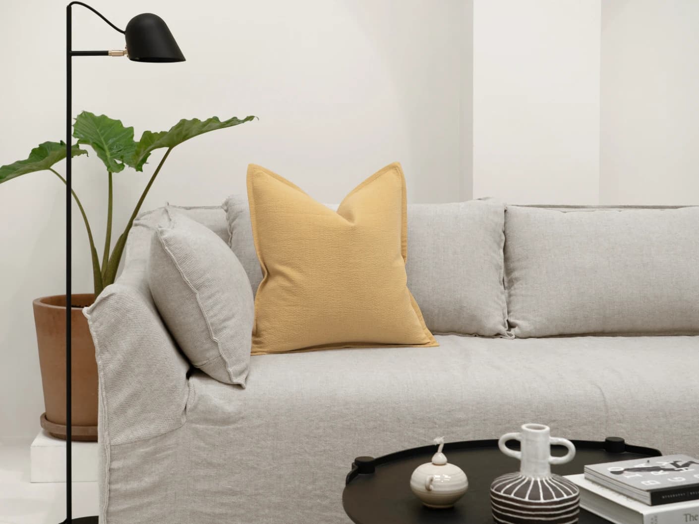 Siena Barrymore single cushions in yellow, shown in a lifestyle front view