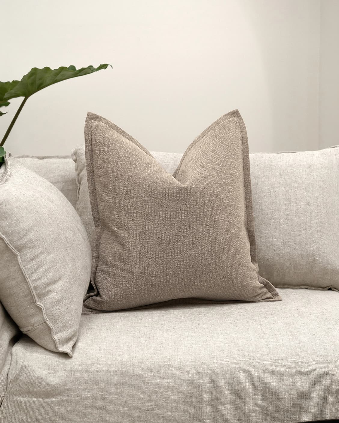 Siena Braun cushion in beige and grey, shown in a lifestyle front view as image 2