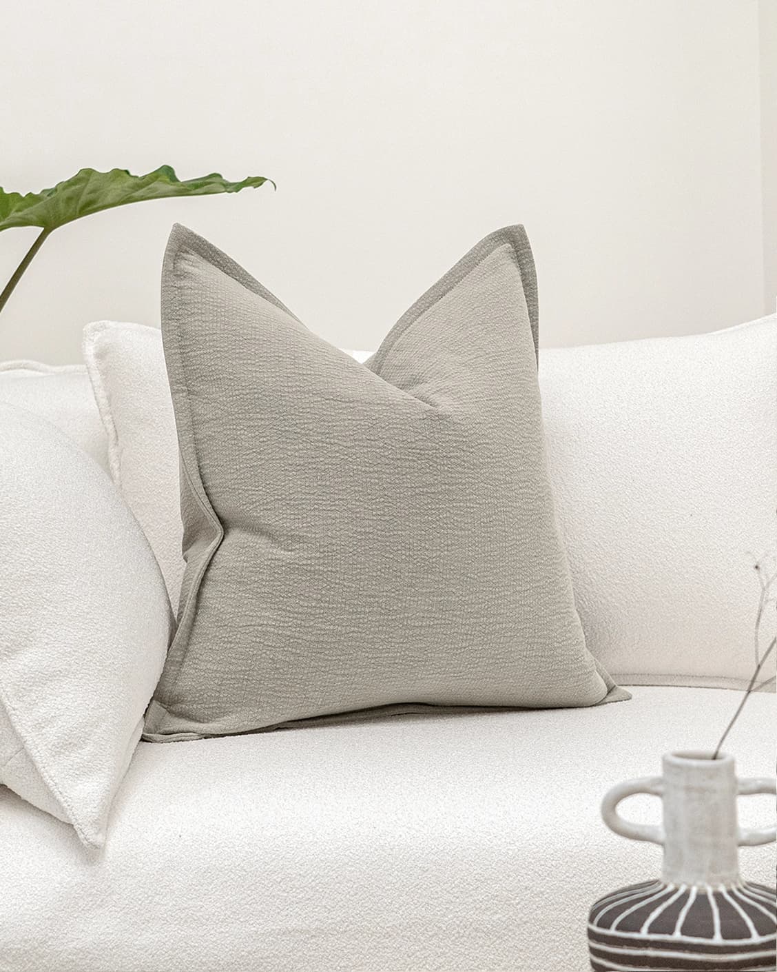 Siena Klimt cushion in grey, shown in a lifestyle front view as image 2