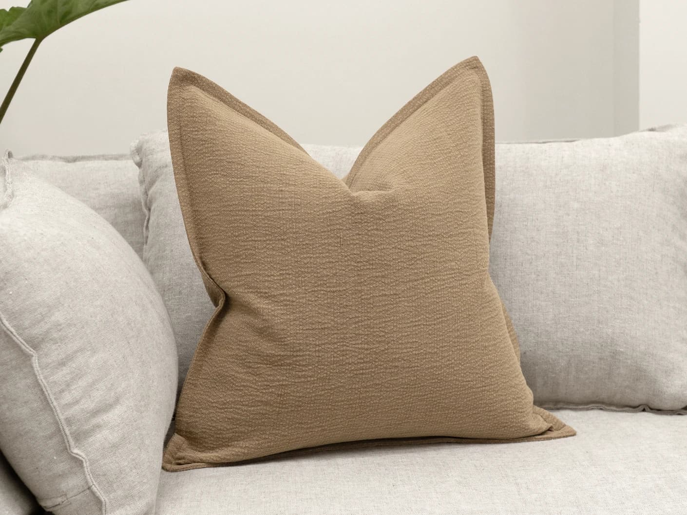 Siena Laurent single cushions in brown, shown in a lifestyle front view