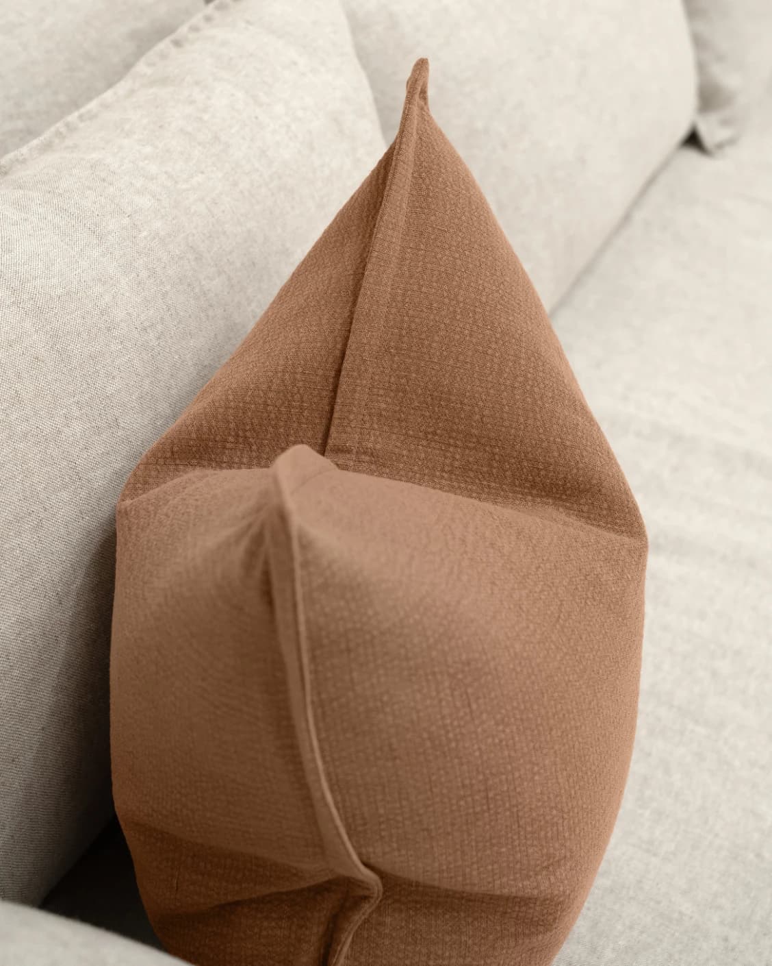 Siena Rust cushion in rust, shown in a lifestyle top view as image 5