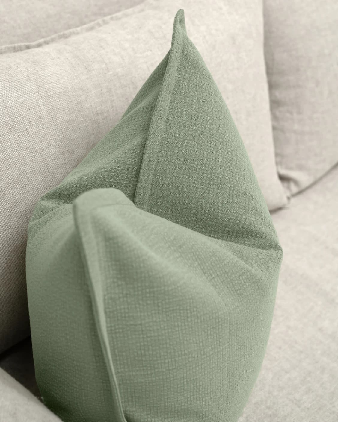 Siena Willow cushion in green, shown in a lifestyle top view as image 6