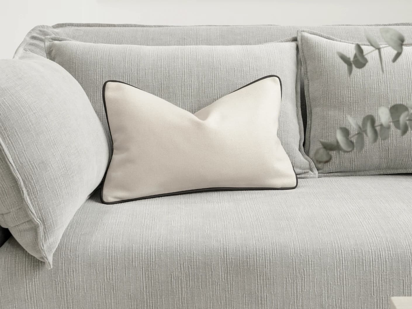 Silvie Bianca II single cushions in off white, shown in a lifestyle front view