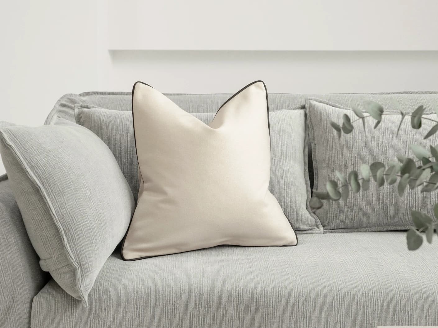 Silvie Bianca cushion in off white, shown in a lifestyle front view as image 4