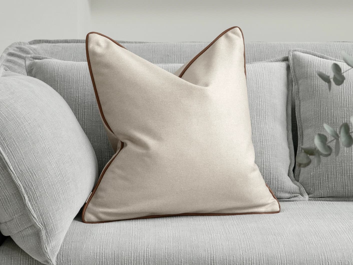 Silvie Klimt single cushions in cream, shown in a lifestyle front view