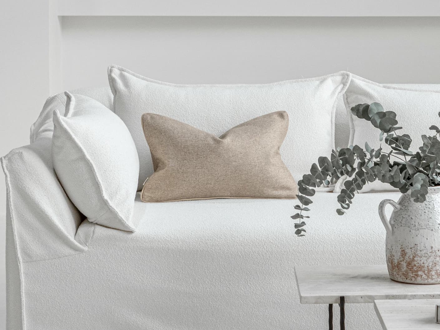 Silvie Laurent II single cushions in taupe, shown in a lifestyle front view