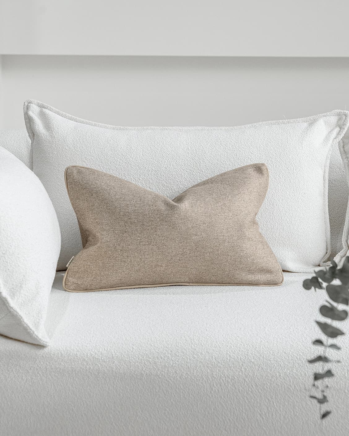Silvie Laurent II cushion in taupe, shown in a lifestyle front view as image 2