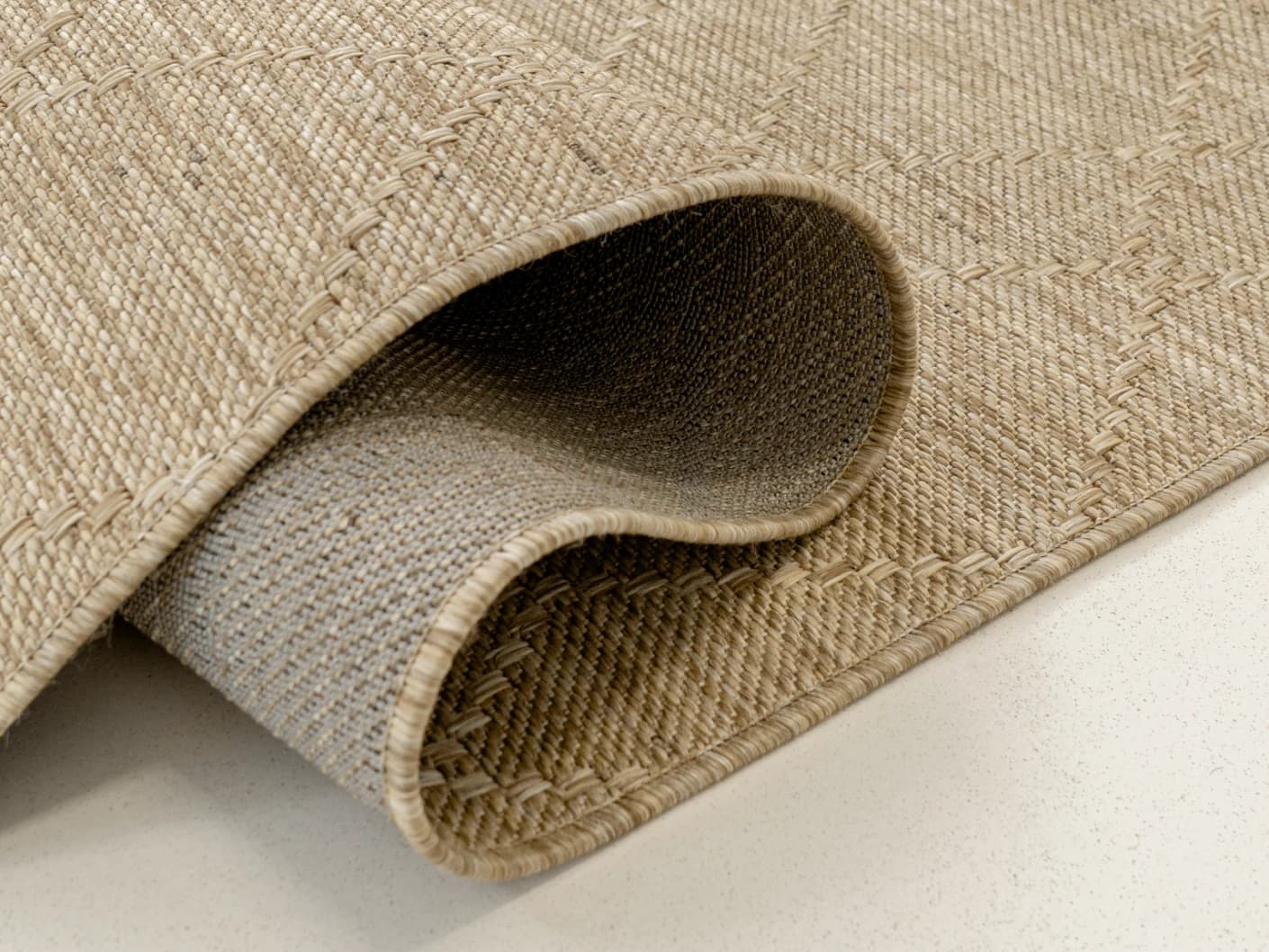 Solana Dune carpets in dune and brown, shown in a product close-up view