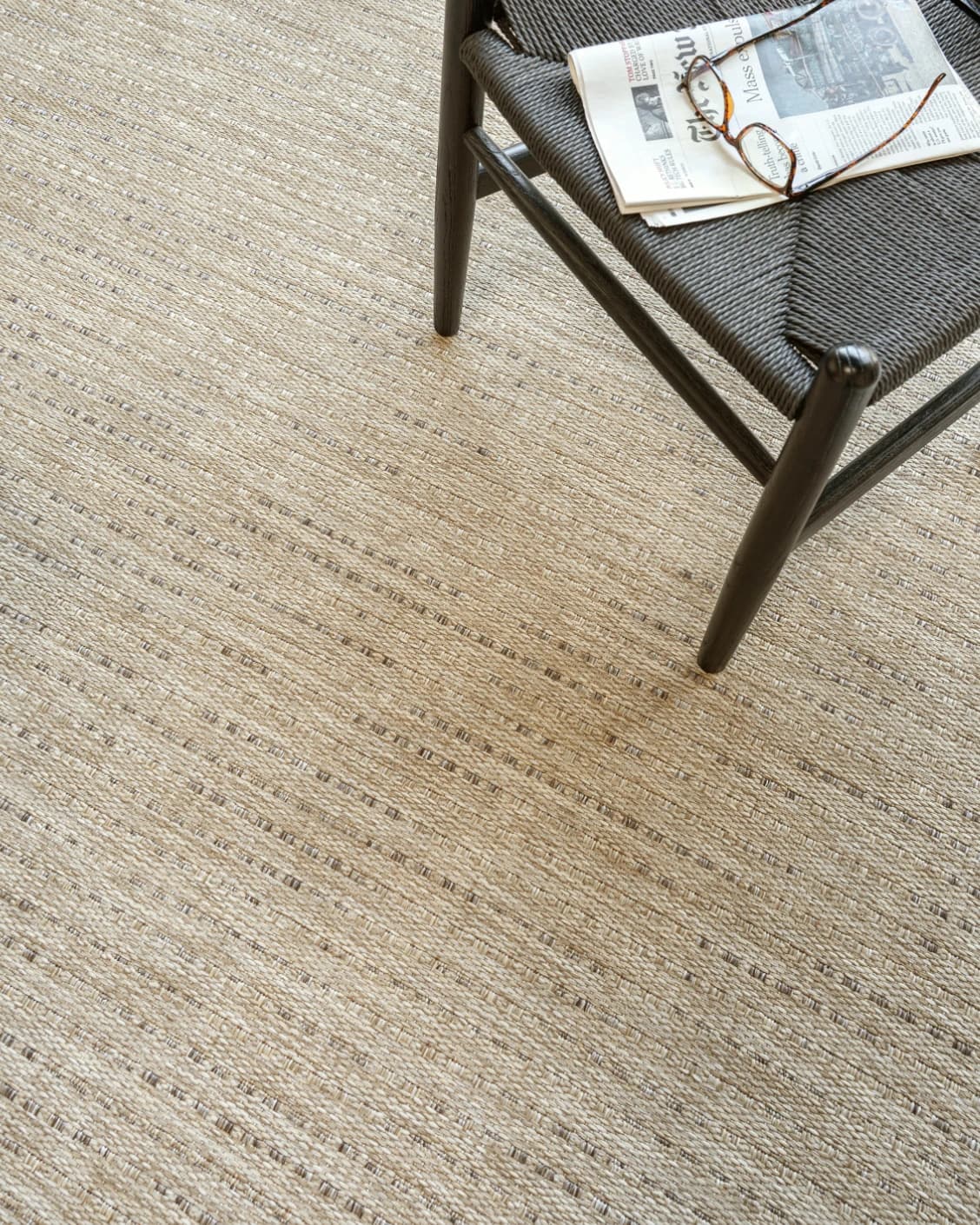 Solana Sandy carpet in sandy and brown, shown in a lifestyle top view as video image