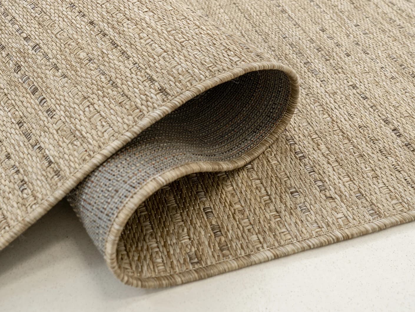 Solana Sandy carpets in sandy and brown, shown in a product close-up view
