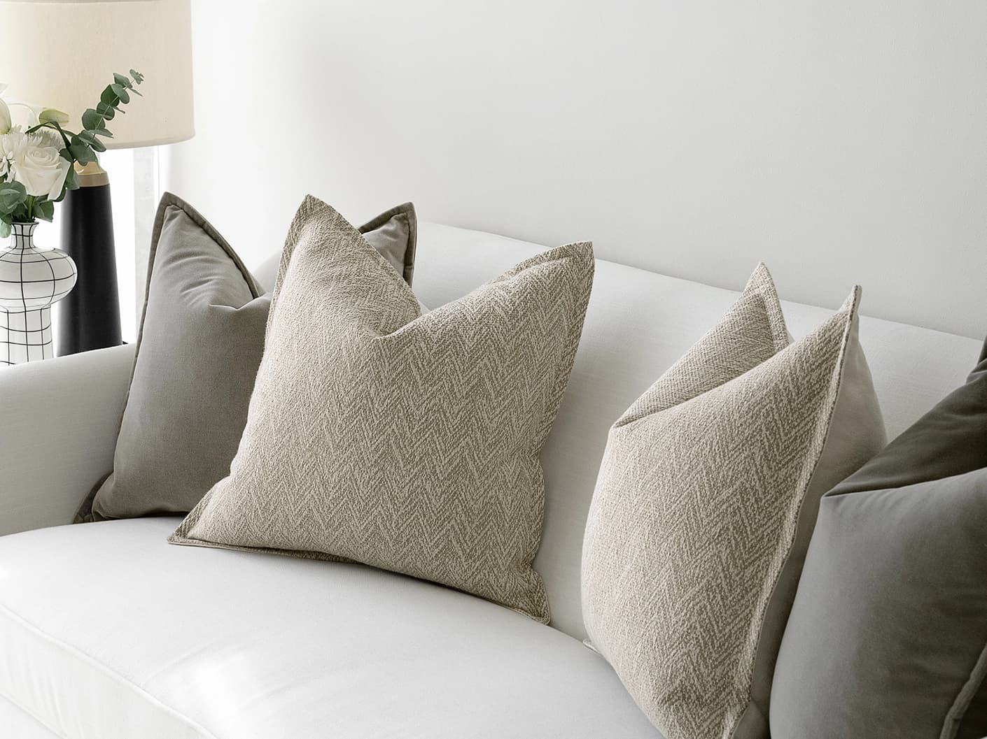Sophie Bundle bundle cushions in grey and beige, shown in a lifestyle front view