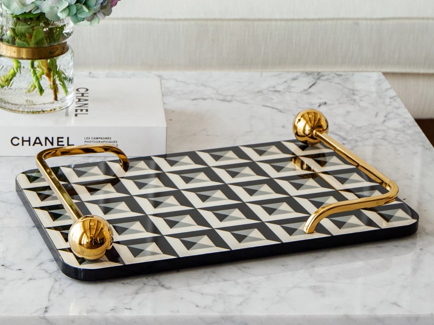 Stephen Bandiagara trays in black and gold, shown in a lifestyle front view