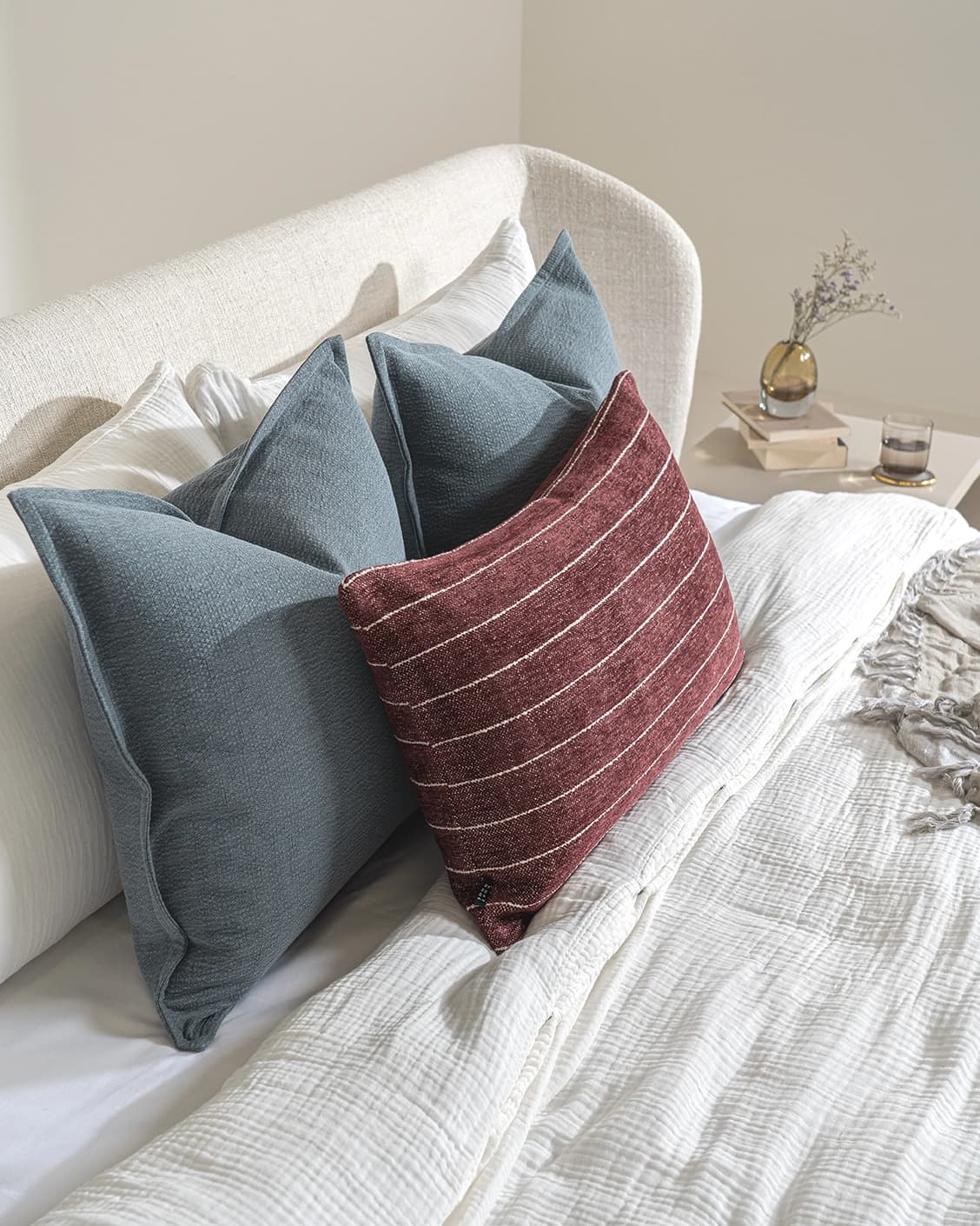 Syed Bundle cushion in blue and red, shown in a lifestyle left view as image 7