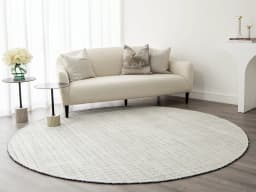 Taylor Bianca Round carpet in black and white, shown in a lifestyle front view