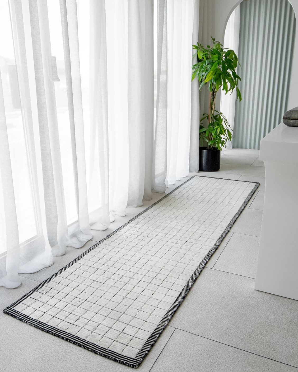 Taylor Bianca Runners carpet in black and white, shown in a lifestyle front view as image 2