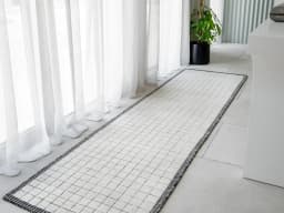 Taylor Bianca Runners carpet in black and white, shown in a lifestyle front view