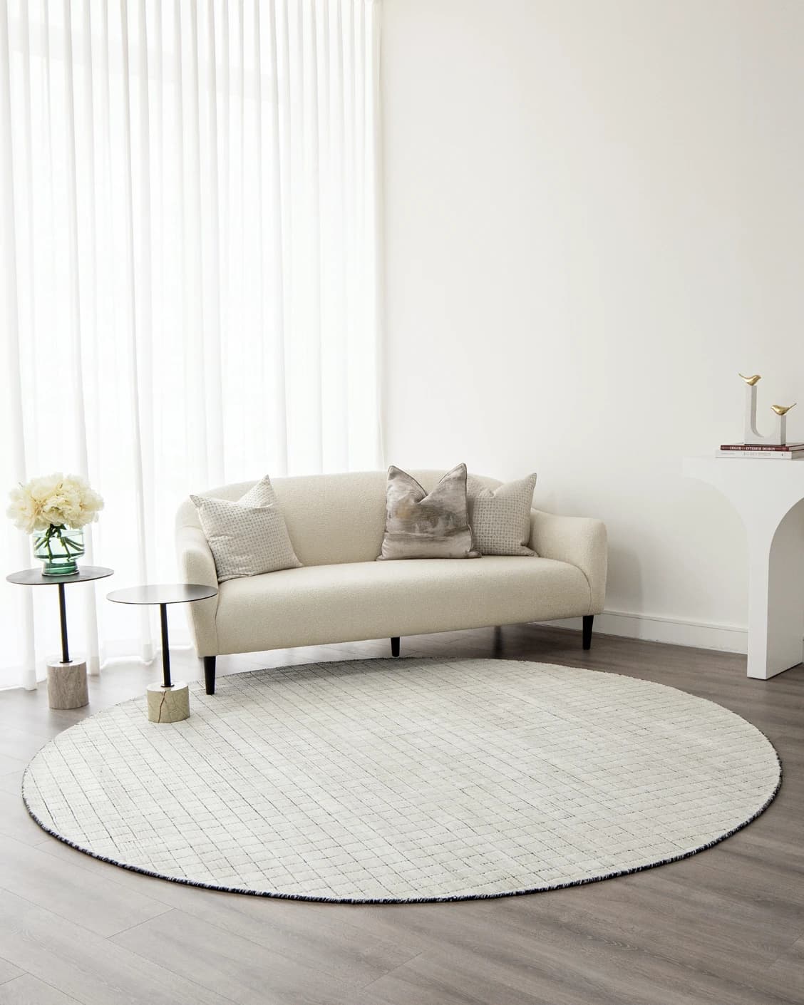 Taylor Bianca Round carpet in black and white, shown in a lifestyle front view