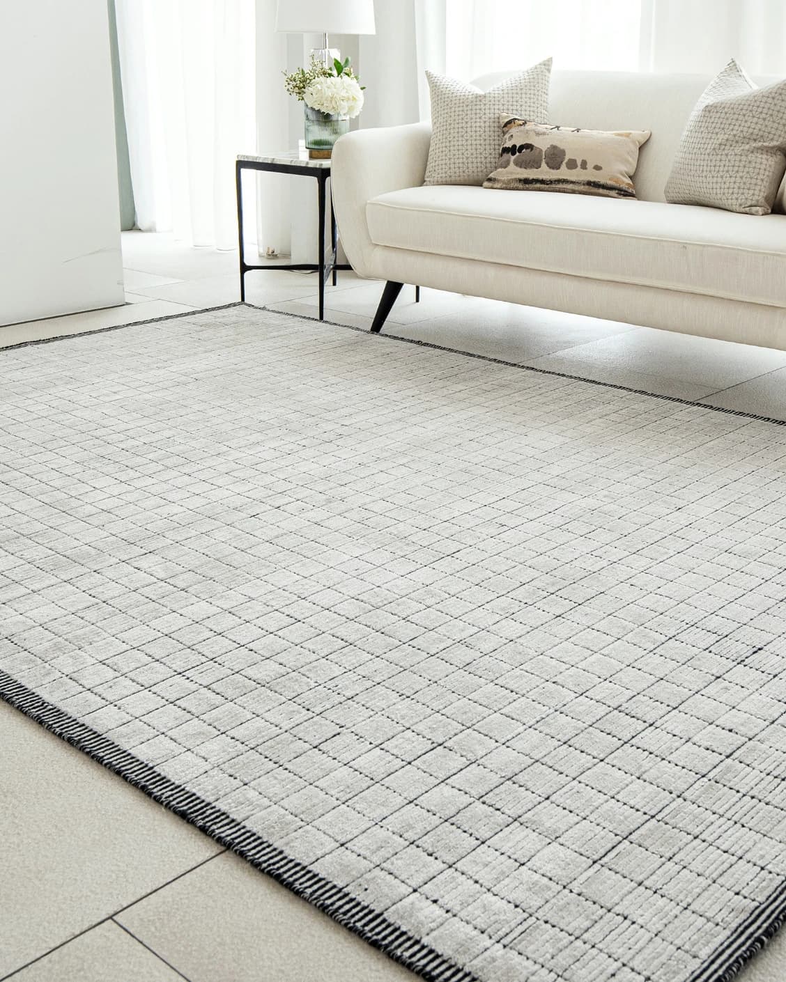 Taylor Bianca carpet in black and white, shown in a lifestyle right view as image 6