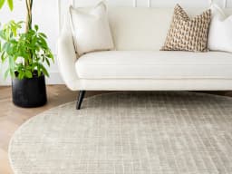 Taylor Dune Round carpet in dune and taupe, shown in a lifestyle front view