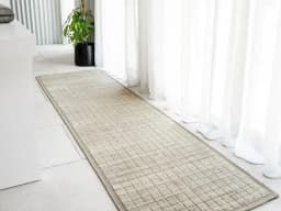 Taylor Dune Runners carpet in taupe, shown in a lifestyle front view