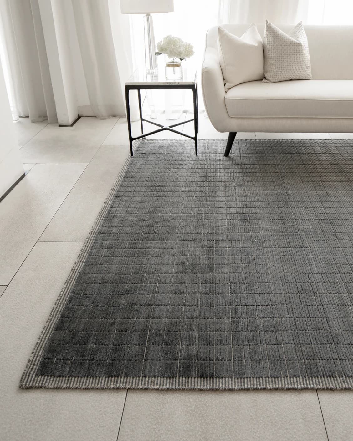 Taylor Ebony carpet in ebony, black and grey, shown in a lifestyle front view as image 4