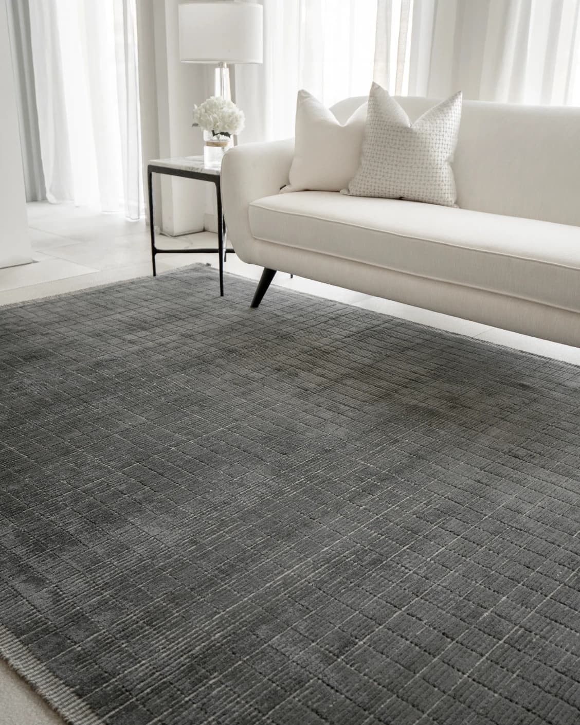 Taylor Ebony carpet in ebony, black and grey, shown in a lifestyle right view as image 6
