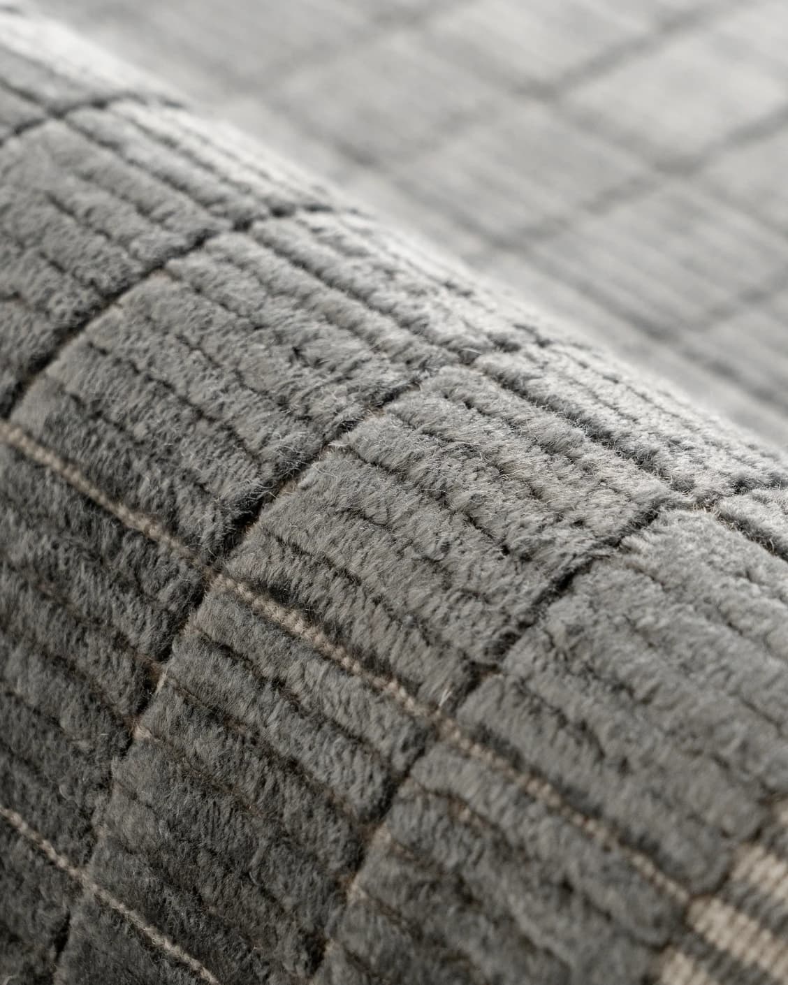 Taylor Ebony Round carpet in ebony, black and grey, shown in a product close-up as image 7