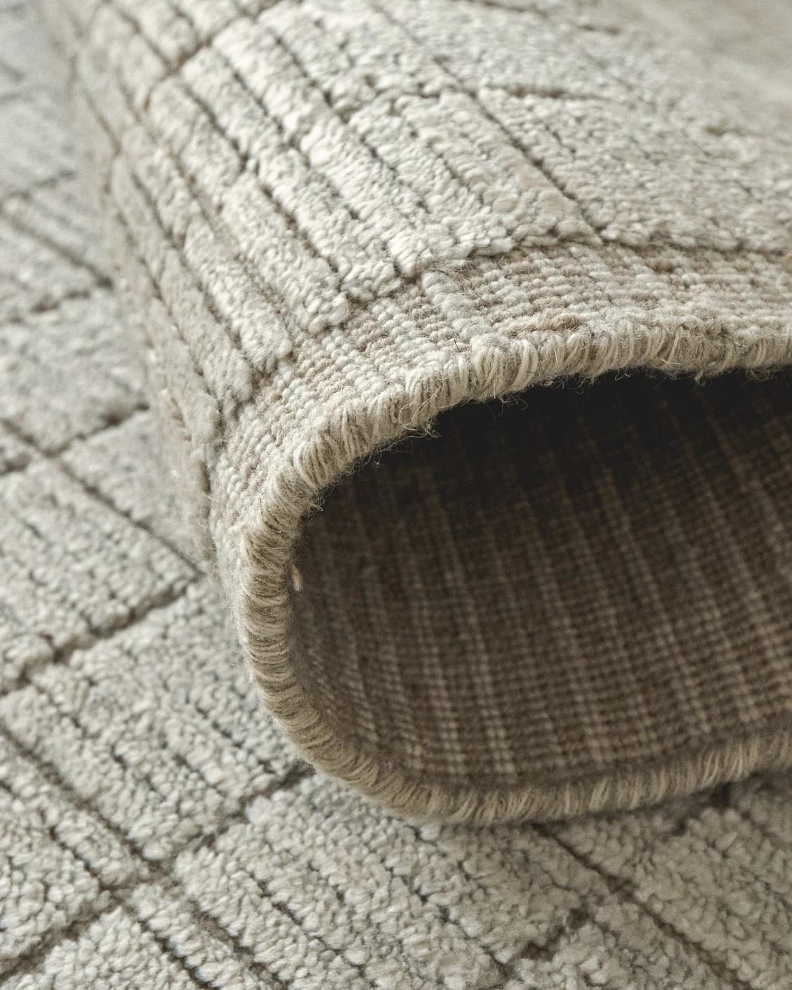 Taylor Sandy carpet in beige, shown in a product close-up as image 7