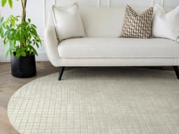 Taylor Sandy Round carpet in sandy and beige, shown in a lifestyle front view