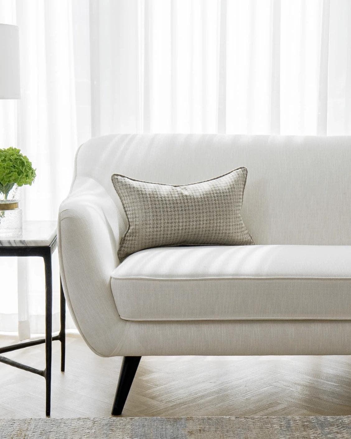 Leo Laurent II cushion in brown and silver, shown in a lifestyle front view as image 4