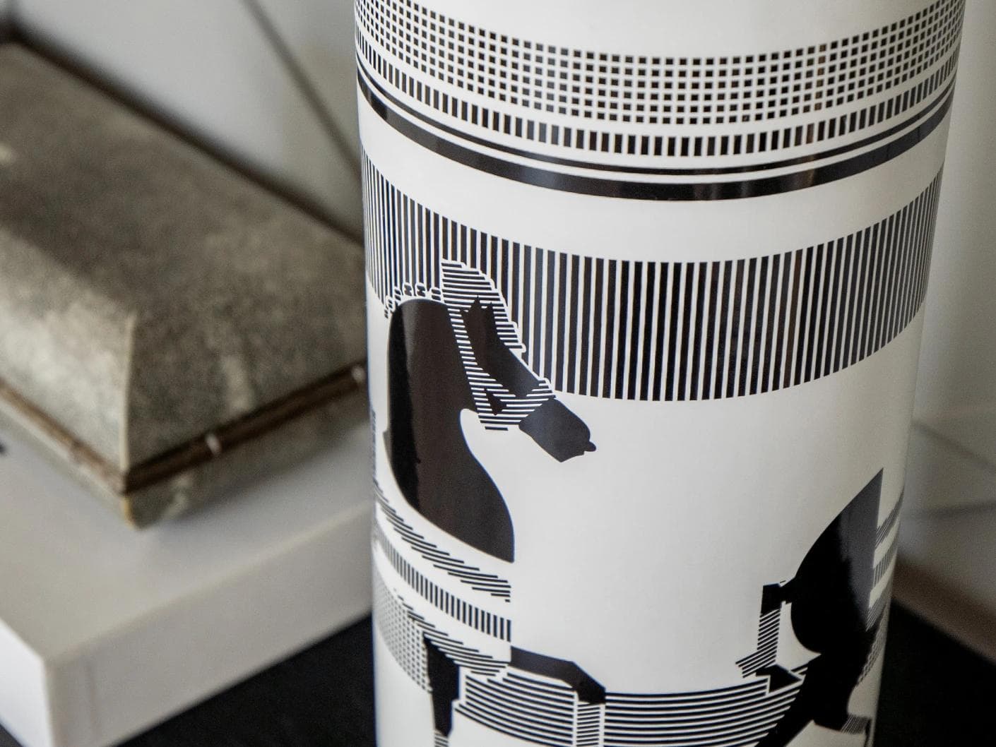 Aurora Arneson vases in white and black, shown in a lifestyle close-up as image 4
